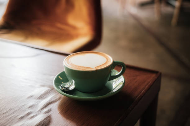 istock Cappuccino coffee with heart in turquoise cup 1159688211