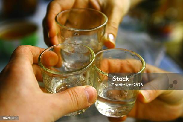 Three Hands Holding Shot Glasses Of Russian Vodka Stock Photo - Download Image Now - Alcohol - Drink, Bar - Drink Establishment, Celebration