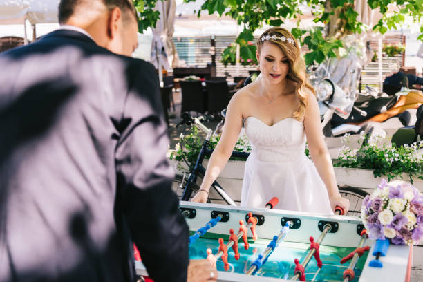 Married Couple Playing Table Football stock photo