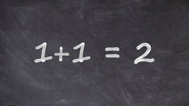 1+1=2 written on blackboard stock photo