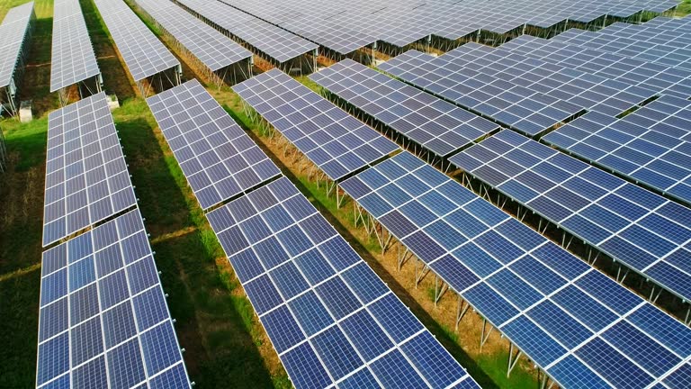 4K Aerial view of Solar Panels Farm (solar cell) with sunlight