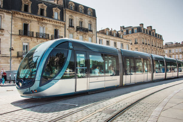Modern tramway in Bordeaux, France A modern electric tramway in Bordeaux, France blurred motion street car green stock pictures, royalty-free photos & images