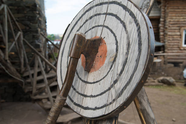 istock Ax in the target, entertainment throwing an ax 1159697490