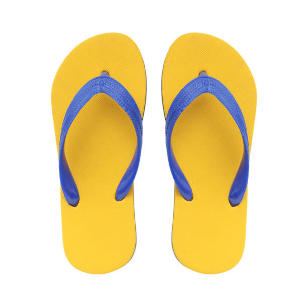 istock Yellow flip flops isolated on white background. 1159697569