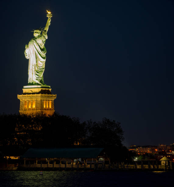 istock Statue of Liberty at night 1159698722