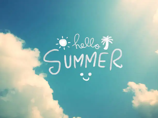 Photo of Hello Summer word on beautiful blue sky with sunlight background