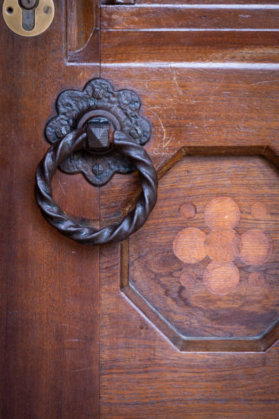 istock Iron Door Handle on Wooden Door 1159699784
