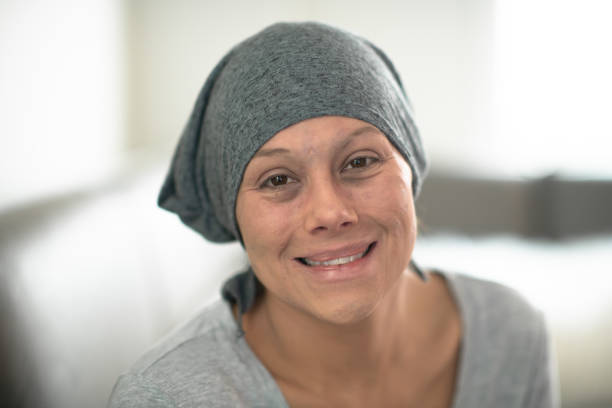 istock Woman wearing headscarf due to chemo smiling 1159700301