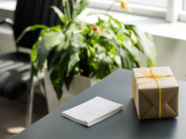istock corporate birthday party wrapped gift box desk 1159700432