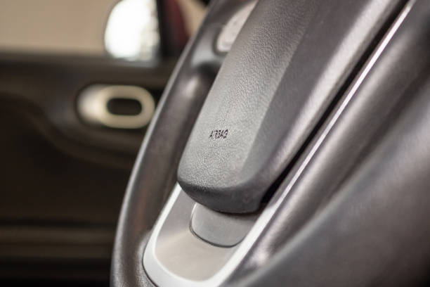 istock Safety airbag sign on car steering wheel 1159700625