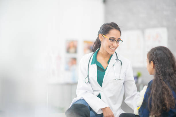 istock Doctor Comforting A Girl 1159701464