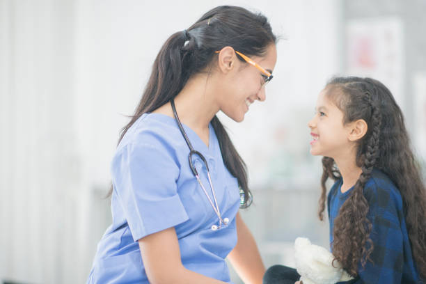 istock Doctor Comforting A Girl 1159701475