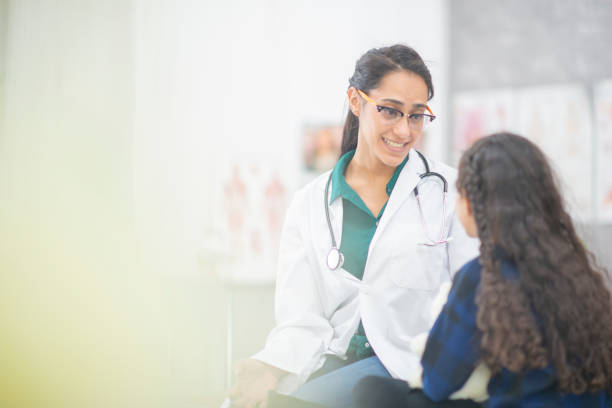istock Doctor Comforting A Girl 1159701487