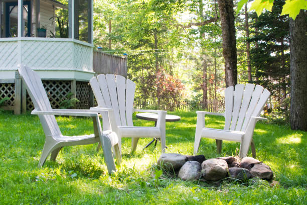 istock Garden chairs behind a house 1159703488