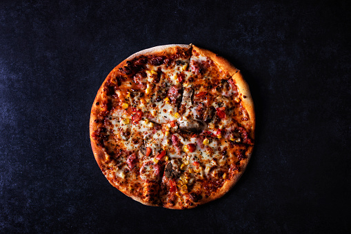 pizza on black concrete background