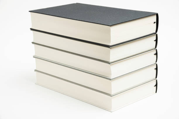 A Set Of Neatly Stacked Monochromatic Cloth Bound Books