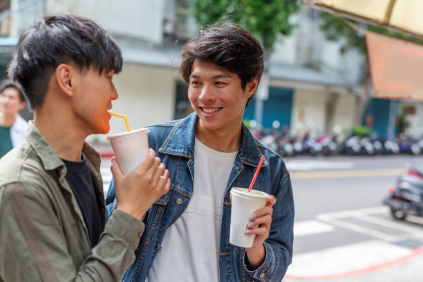 istock Group of Friends Drinking Juice Together 1159707574