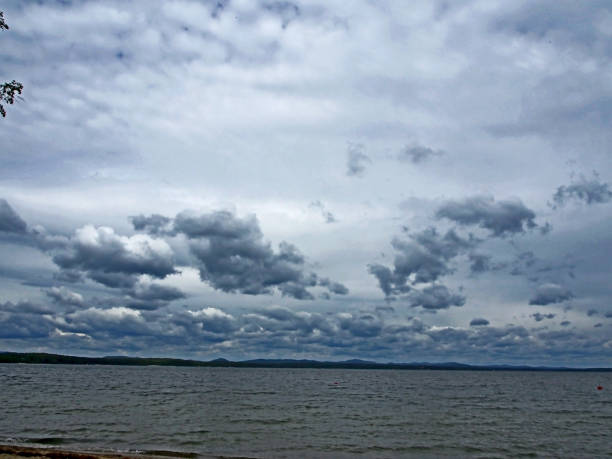 istock heavy gray clouds over the lake on a cloudy evening 1159720515