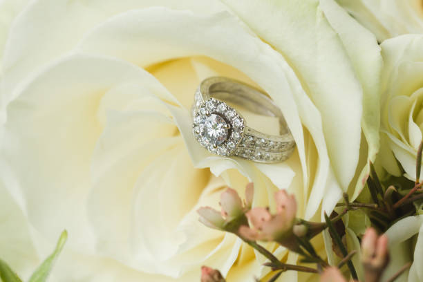 istock Wedding rings in bridal bouquet 1159724569