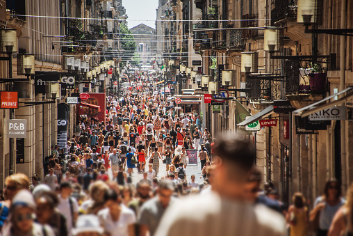 Rue Sainte-Catherine crowded of pedestrians in Bordeaux, France. This street is one of the longest shopping streets in Europe.