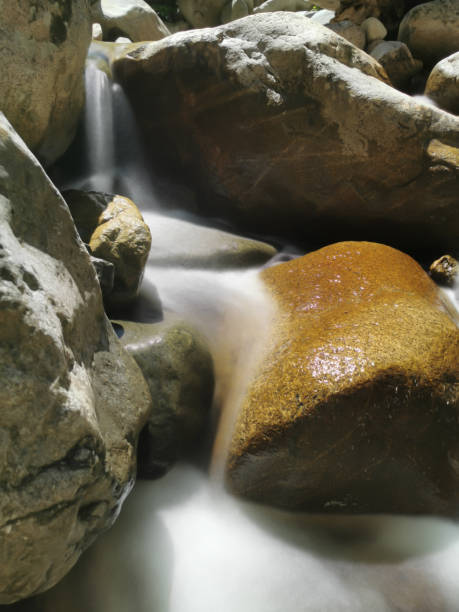 istock Silky Water Stream Brook River Runs over River Rocks 1159738011