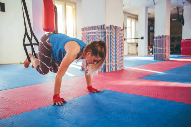 istock Woman exercising in gym 1159738304