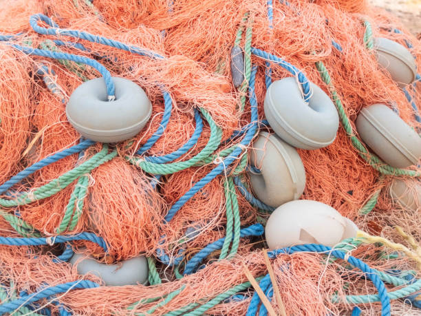 istock Old tangle colorful fisherman net with floaters 1159739159