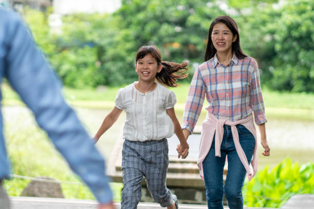 istock Young girl running towards her father 1159739418
