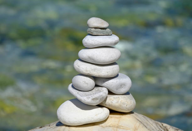 istock Tower of balanced stones on the sea coast 1159740164