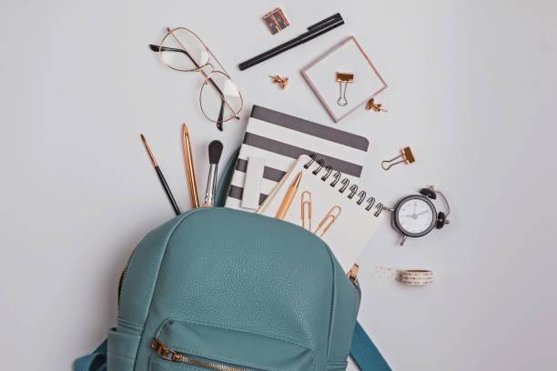 istock Student's backpack with different stationery and study supplies on the white background 1159742313