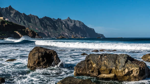istock Ocean foam among the big stones 1159743634