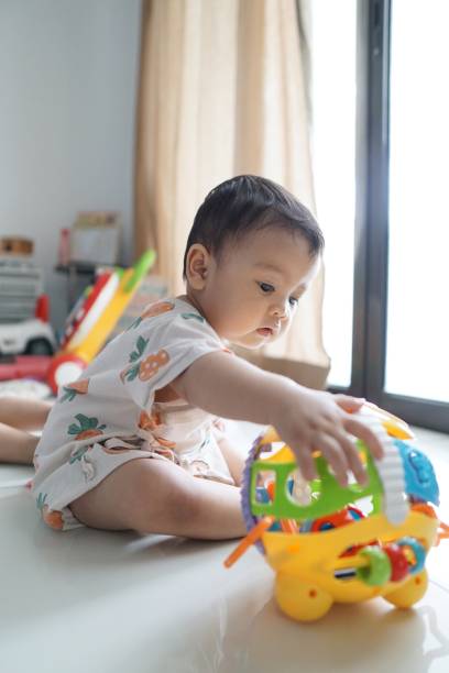 istock Two siblings playing together at home 1159745347