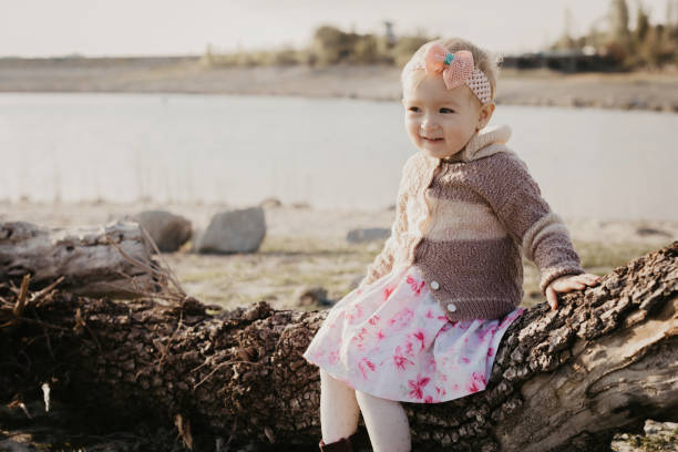 istock Sweet little girl outdoors - Image 1159746524