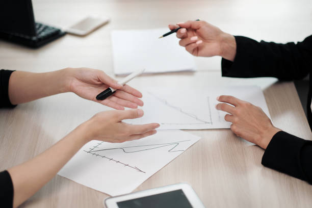 istock Close-up desktop. Tablet, charts and documents. The concept of team office work. Women at work. 1159746655