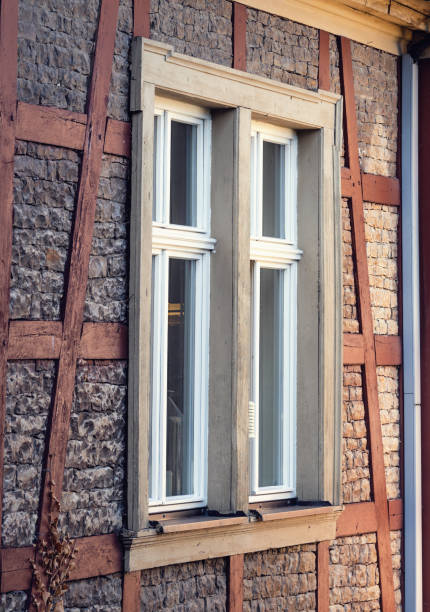 istock Big window on an old historical sandstone facade building 1159747740