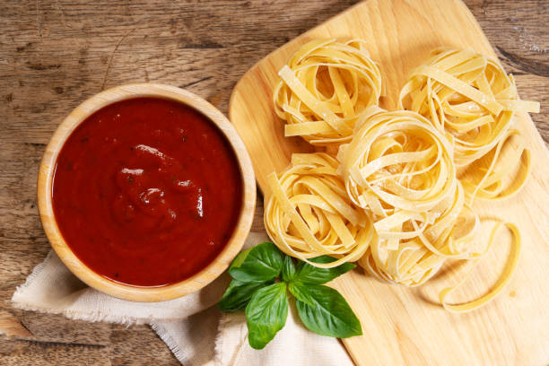 istock Dried pasta fettuccine with ingredients 1159748934