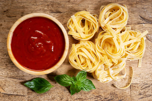 istock Dried pasta fettuccine with ingredients 1159748939