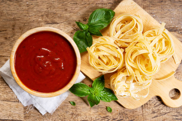 istock Dried pasta fettuccine with ingredients 1159748943
