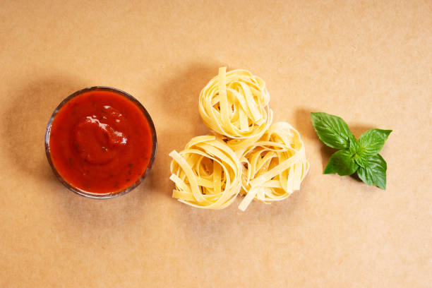 istock Dried pasta fettuccine with ingredients 1159748948