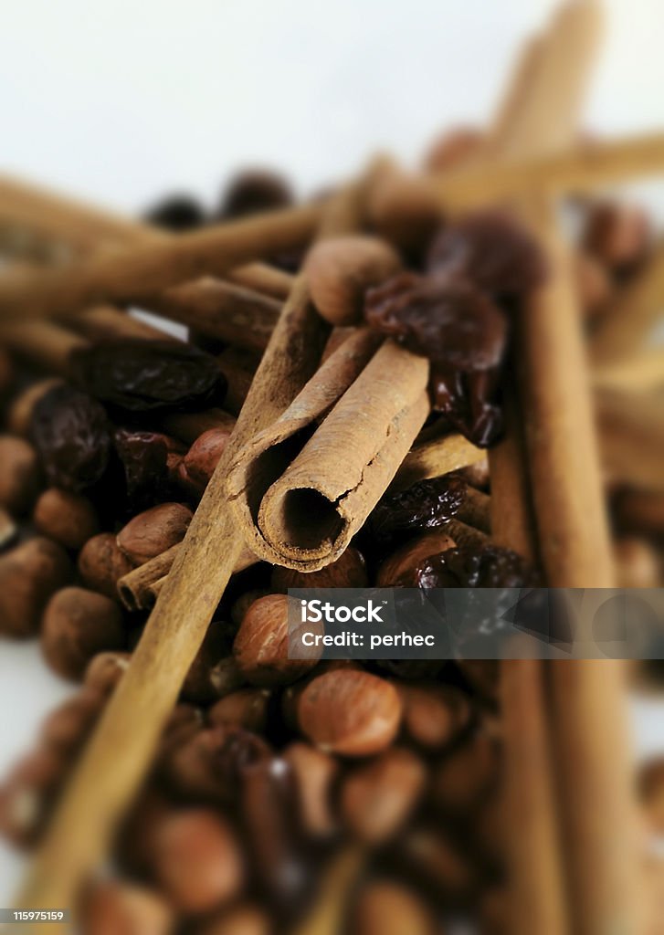 Cinnamon mix Cinnamon stics with hazel nuts and raisins Brown Stock Photo