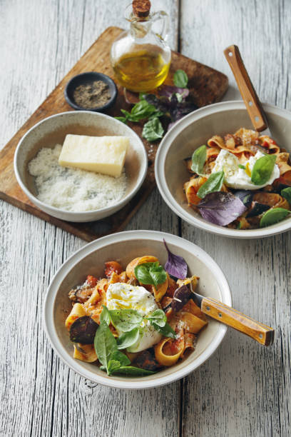 istock Pappardelle with eggplant, creamy tomato sauce and mozzarella 1159753286