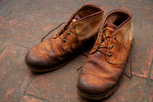 istock Old shoes, used in the fields 1159753434