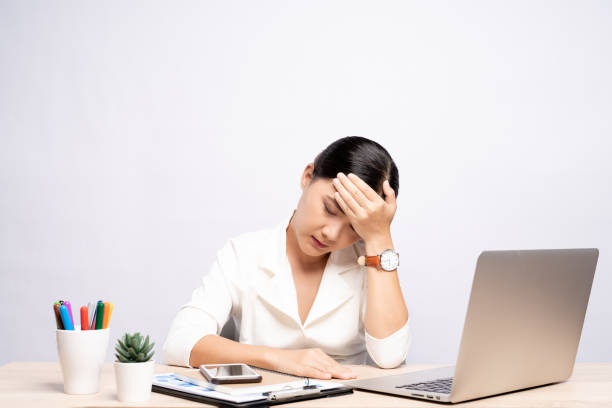 istock Woman has headache at office isolated over white background 1159754540