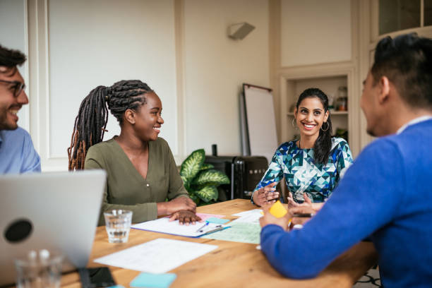 istock Millennial investors working together on blockchain internet platform that will generate income. 1159756701