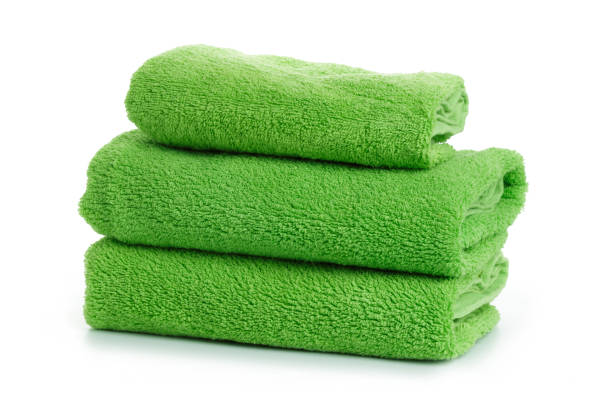 A stack of towels green on a white background