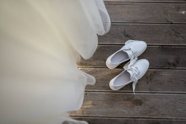 Wedding dress and high heels shoes next to it