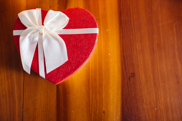 istock Christmas Gifts on Wooden Table 1159760855