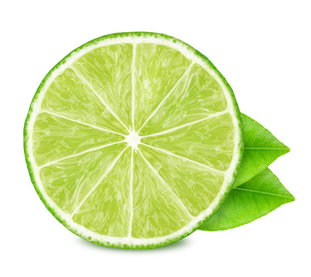 istock Half of lime with leaves isolated on white background. 1159762036