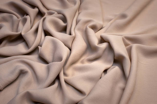 istock Silk fabric with synthetics. Color beige. Texture, background, pattern. 1159763363
