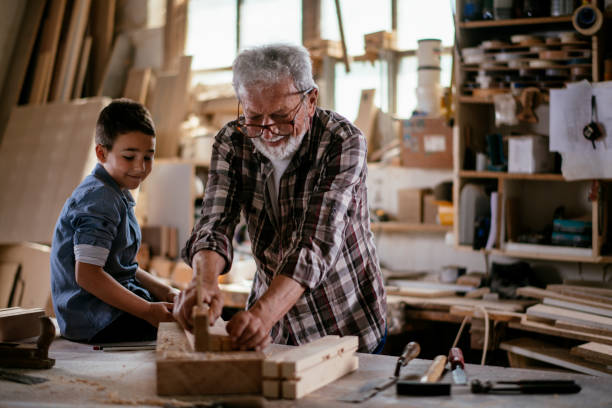 istock Grandfather teaching his grandson 1159763860